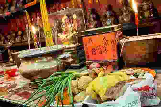 A Family Placing Food Offerings On An Ancestral Altar In China Dying To Eat: Cross Cultural Perspectives On Food Death And The Afterlife (Material Worlds)