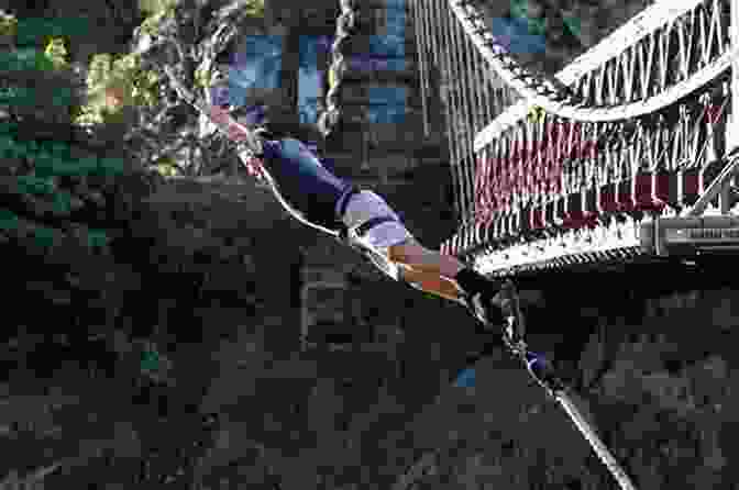 A Person Bungee Jumping Off A Bridge In Queenstown, With The Mountains And Lake In The Background The West S Awake: The Queenstown 2