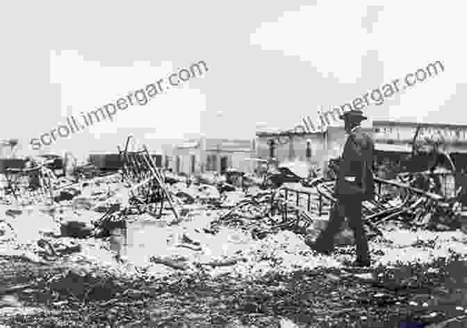 Grainy Black And White Photograph Depicting The Aftermath Of The Tulsa Race Massacre, With Buildings In Ruins And Smoke Rising Into The Sky The Burning: The Tulsa Race Massacre Of 1921